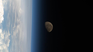 The Moon sets behind Earth as a storm of light roars in Australia